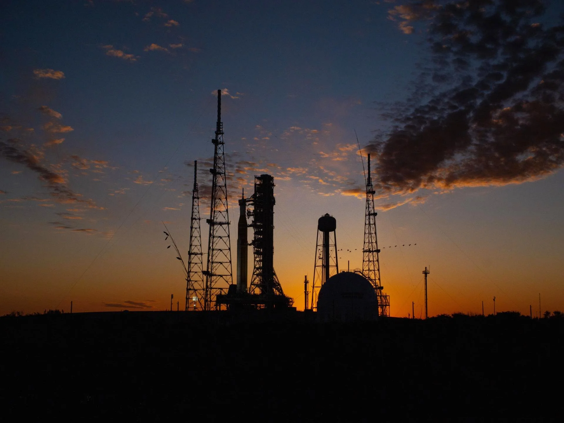 NASA's Space Launch System rocket at the pad at sunset, Launch Pad 39B, Kennedy Space Center.